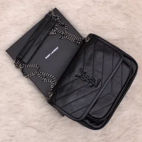 Sac Niki Baby en cuir vintage froissé noir – Saint Laurent