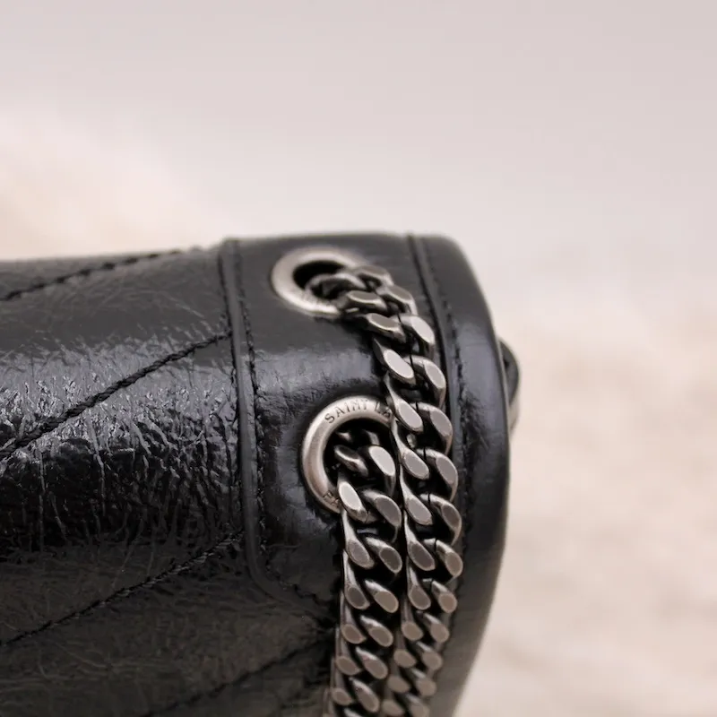 Sac Niki Baby en cuir vintage froissé noir – Saint Laurent